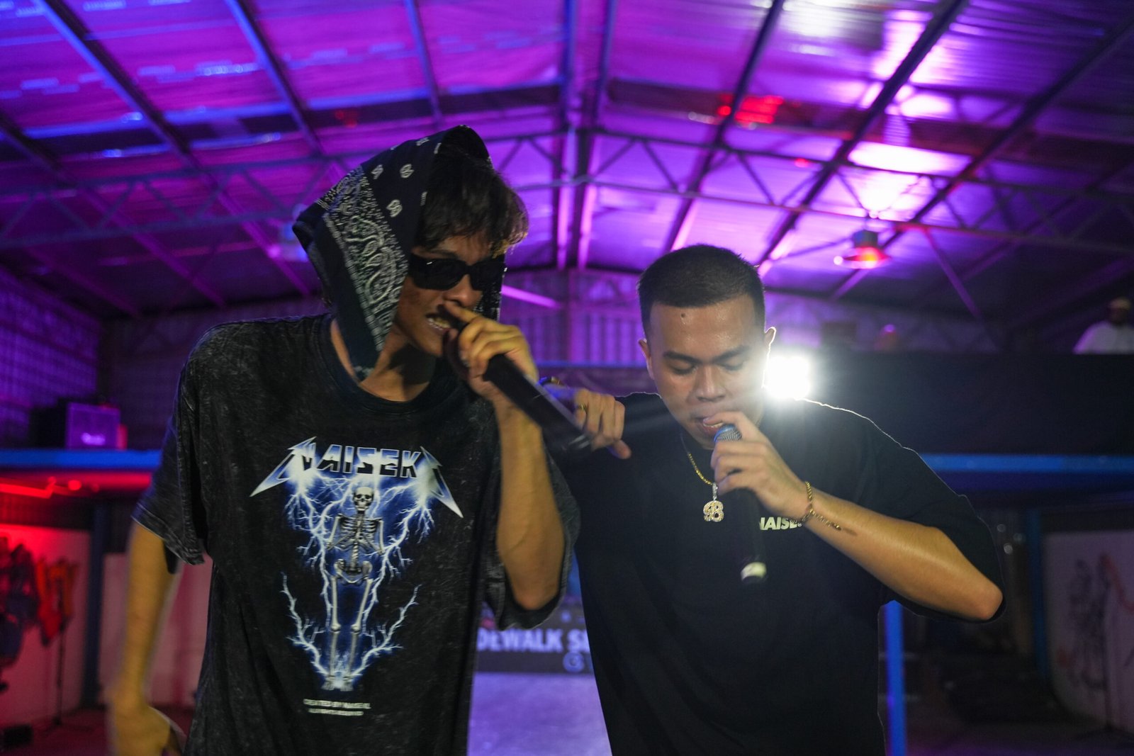 two men rapping at the stage